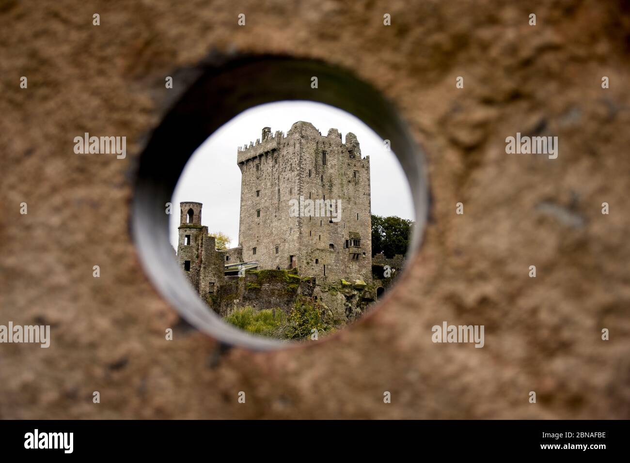Beautiful shot of Blarney Castle in Ireland seen through the concrete hole Stock Photo