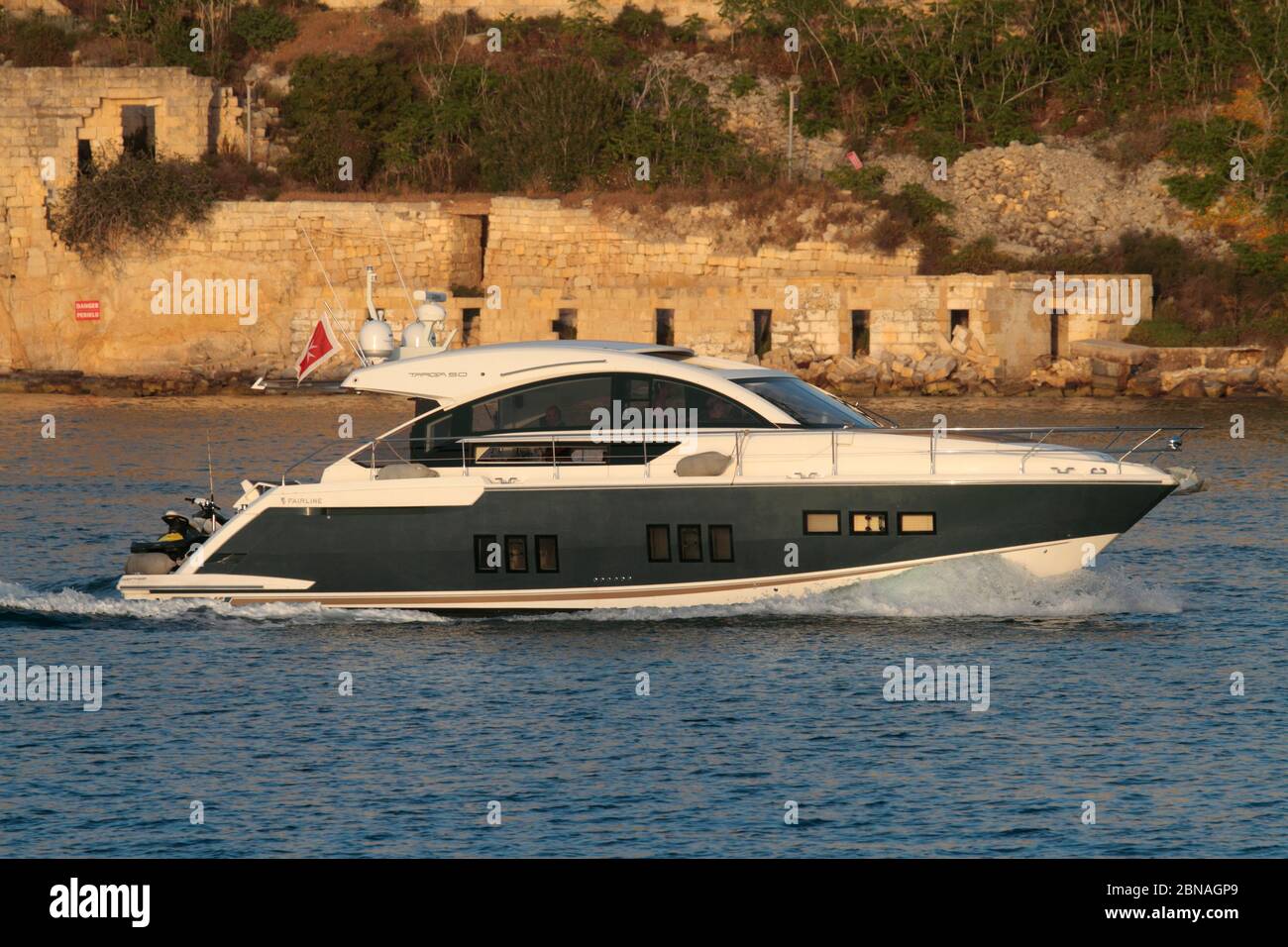 Fairline Targa 50 large luxury motor yacht entering Marsamxett harbour, Malta. Stock Photo