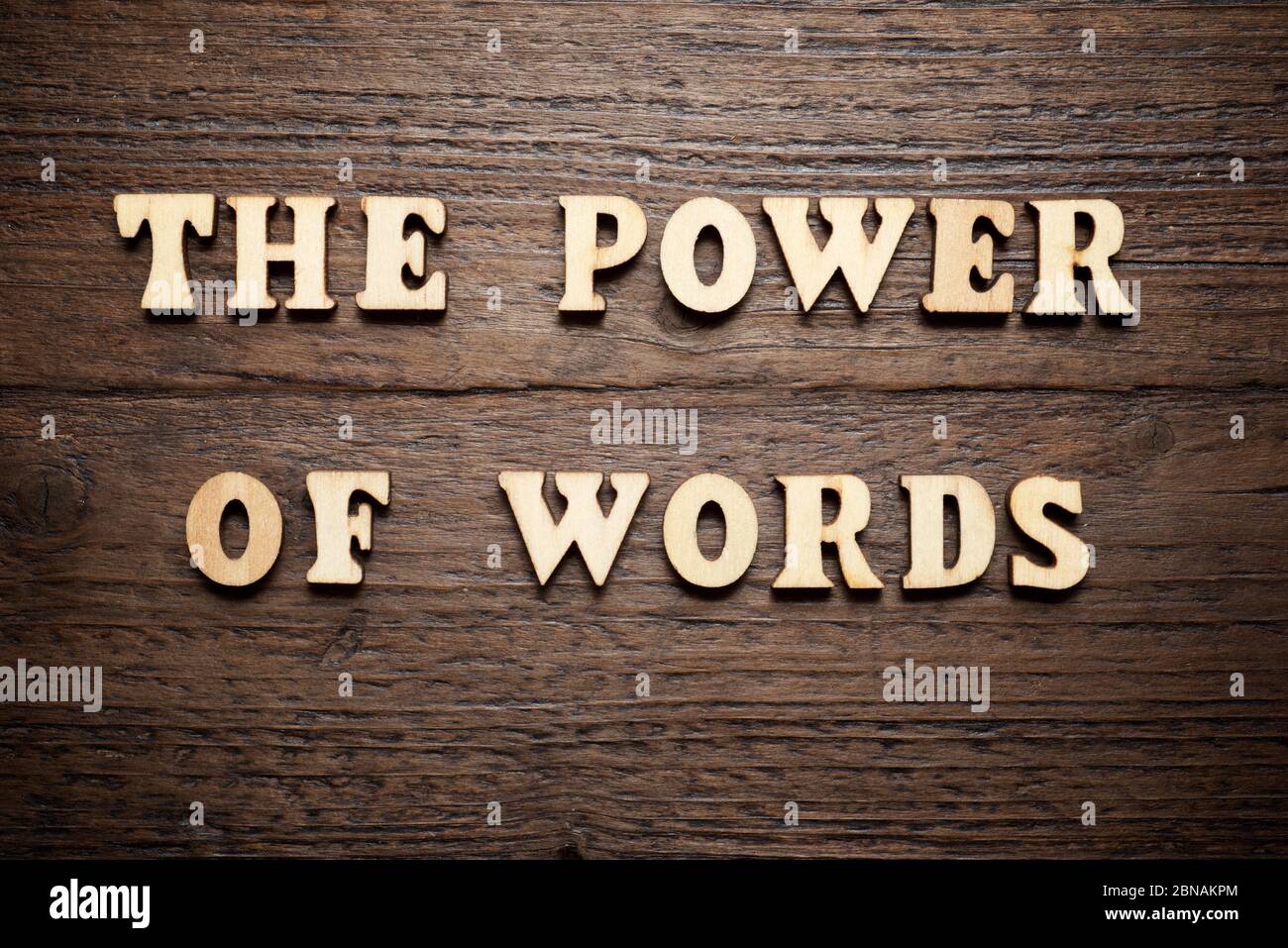 The power of words text on a wood table. Stock Photo