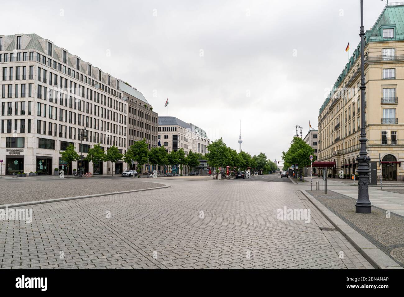 View east along the prominent boulevard Unter den Linden from Pariser Platz in Berlin, Germany, with the TV Tower in the distance Stock Photo