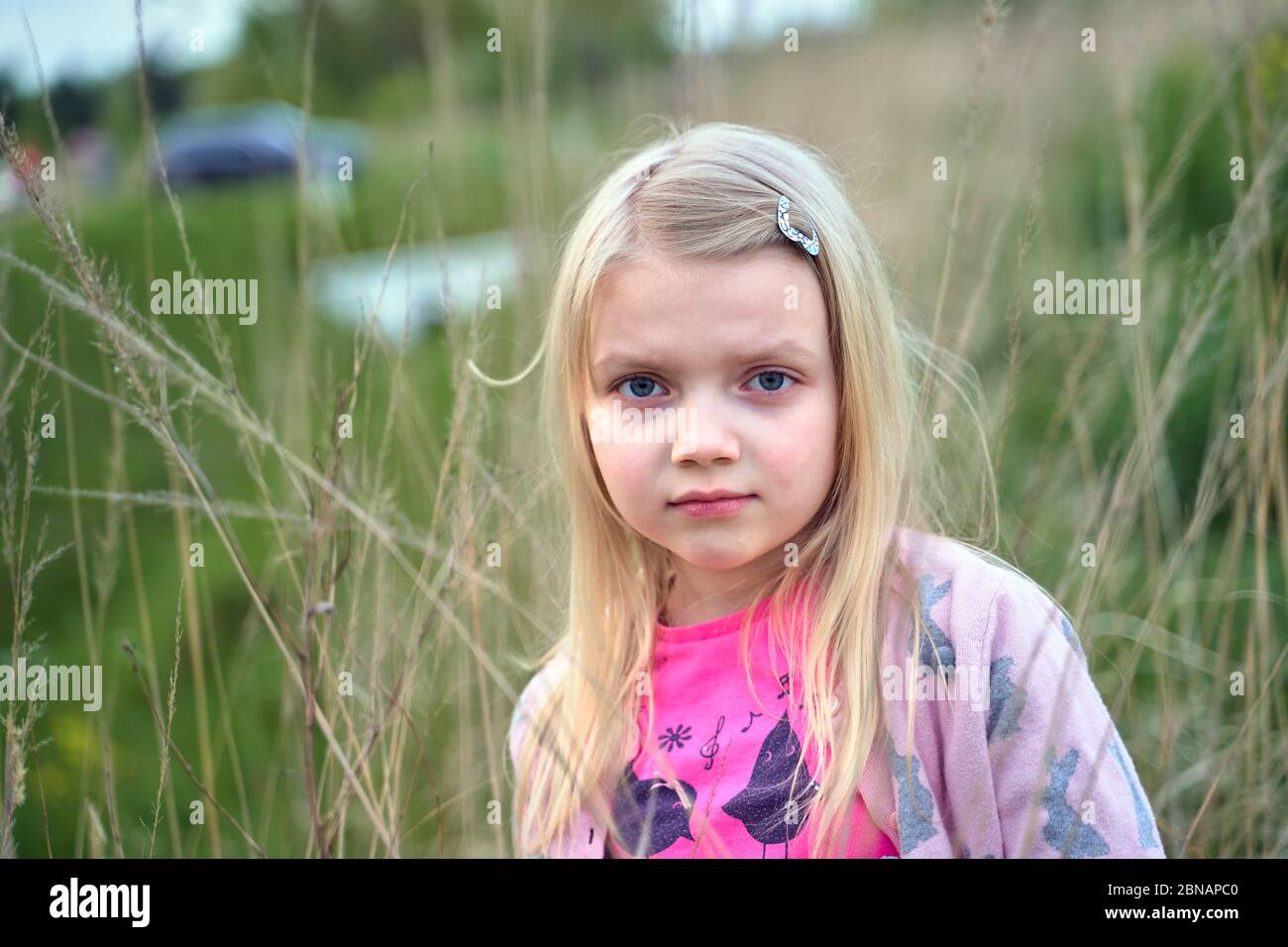 young girl in a rapeseed field Stock Photo - Alamy