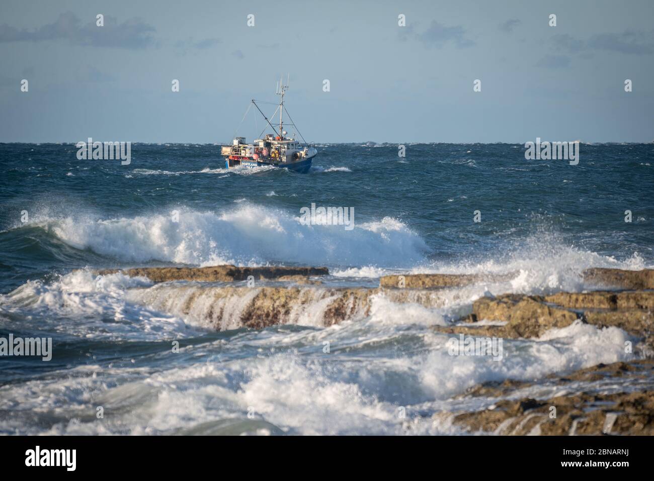 Portland Bill, Dorset, UK. 14th MAY, 2020. UK Weather. Fishing boast out at sea by Portland Bill on the south coast of Dorset. Credit: DTNews/Alamy Live Stock Photo