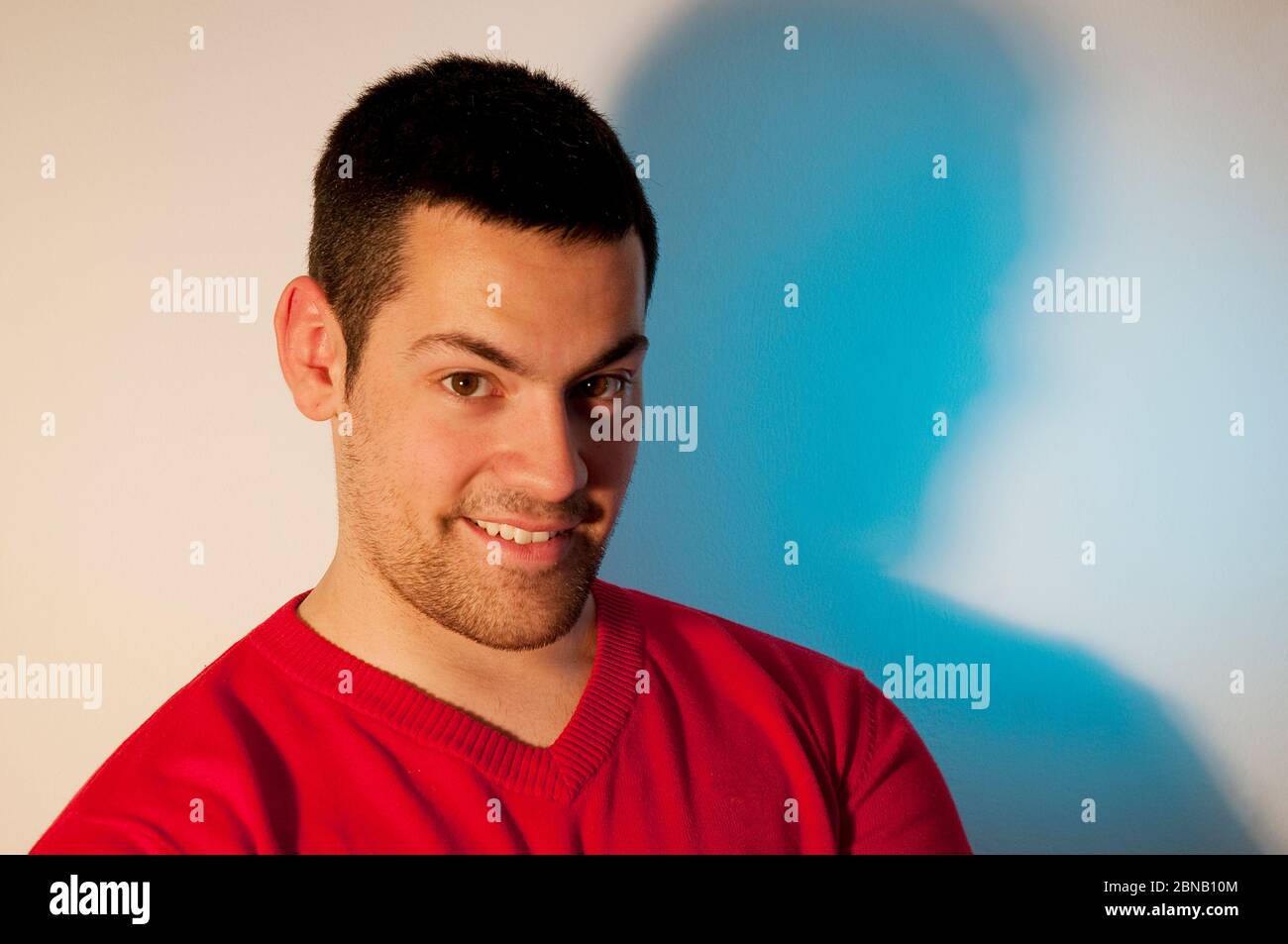 Young man smiling and looking at the camera. Stock Photo