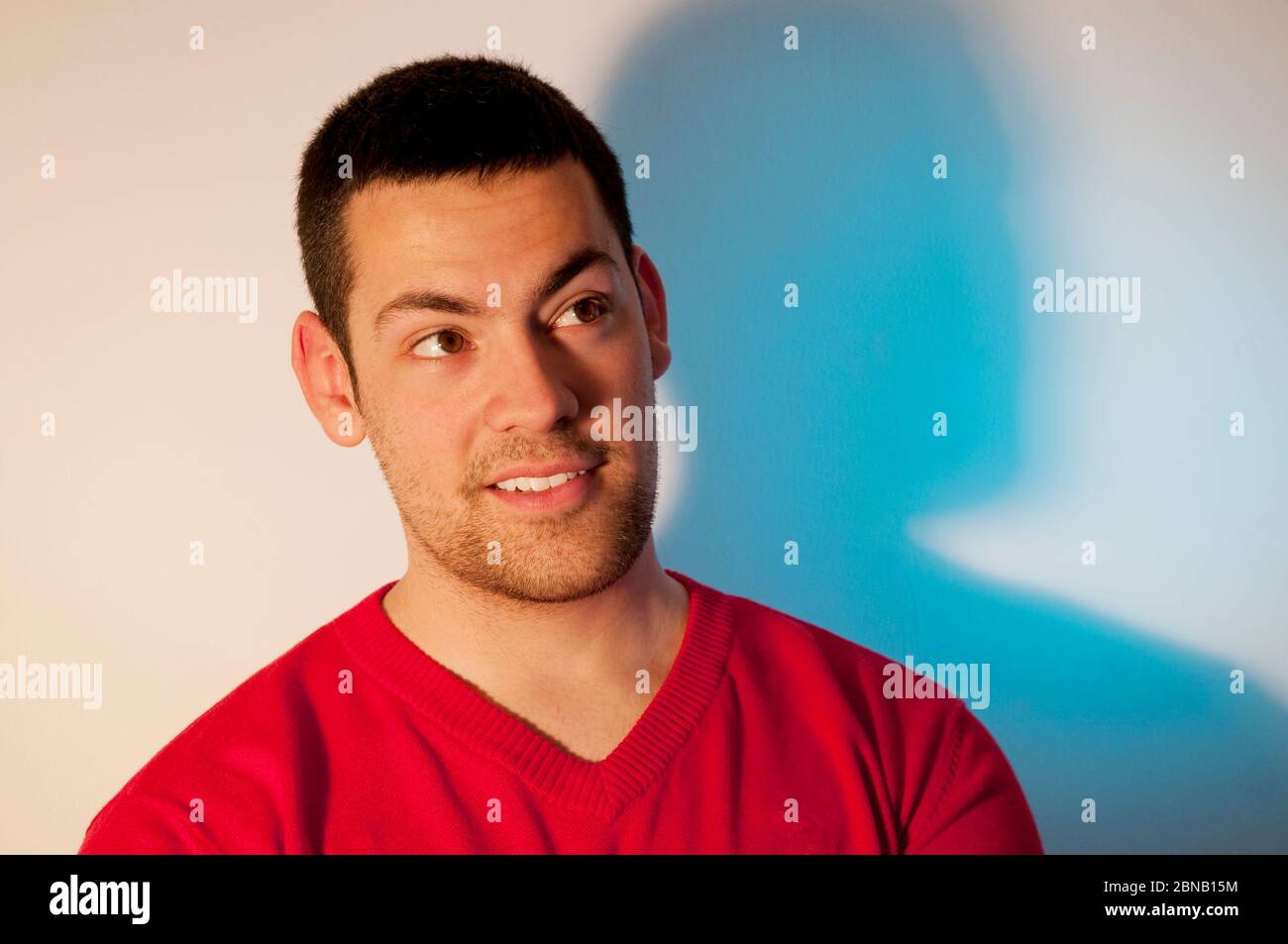 Young man smiling and looking up. Stock Photo
