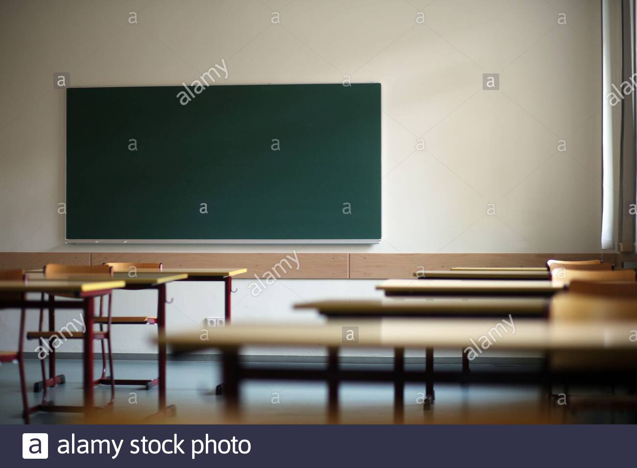 An empty school classroom in Germany during the Corona crisis as lockdown continues in some parts Stock Photo