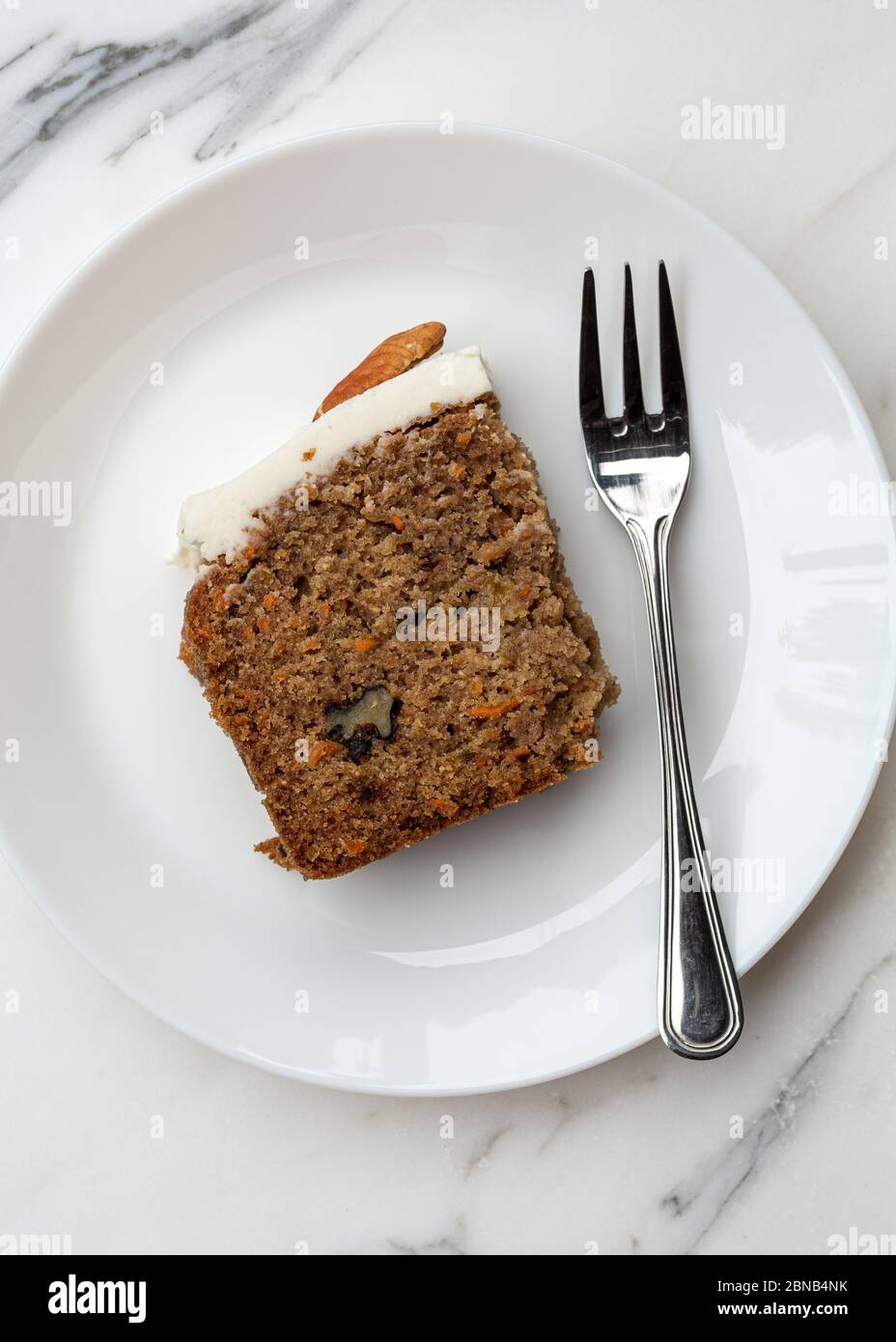 Directly above shot of a slice of carrot cake on plate Stock Photo