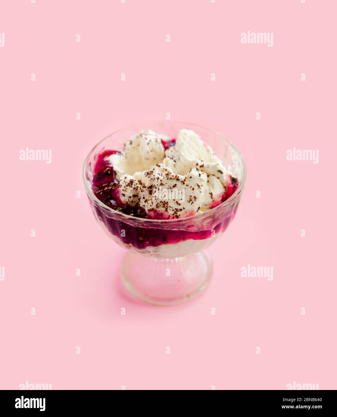 whipped cream dessert with chocolate and jam in a glass bowl Stock