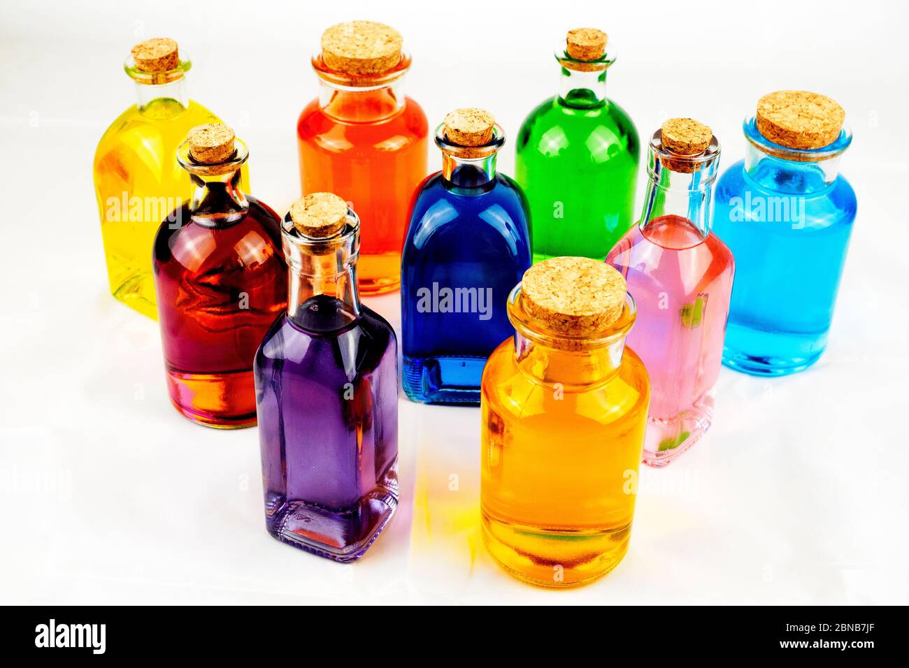 Coloured bottles in white background Stock Photo