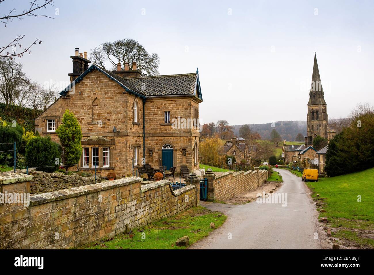 UK, England, Derbyshire, Edensor, mid-victorian hillside house above St Pater's Church Stock Photo