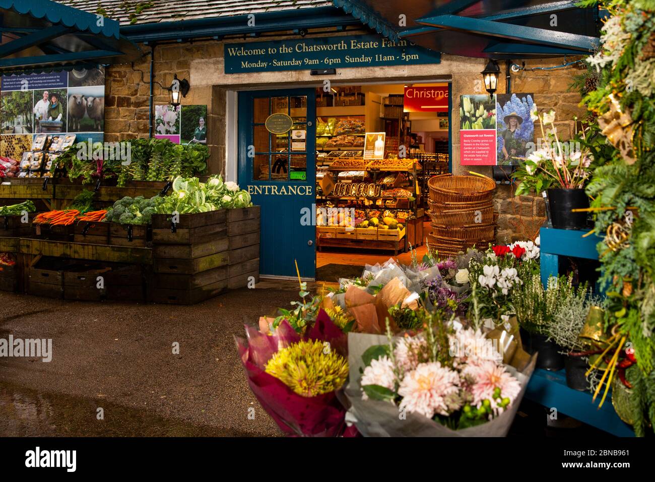 UK, England, Derbyshire, Pilsley, Chatsworth Estate Farm shop in former Stud Farm buildings, flower and vegetable stalls at entrance Stock Photo