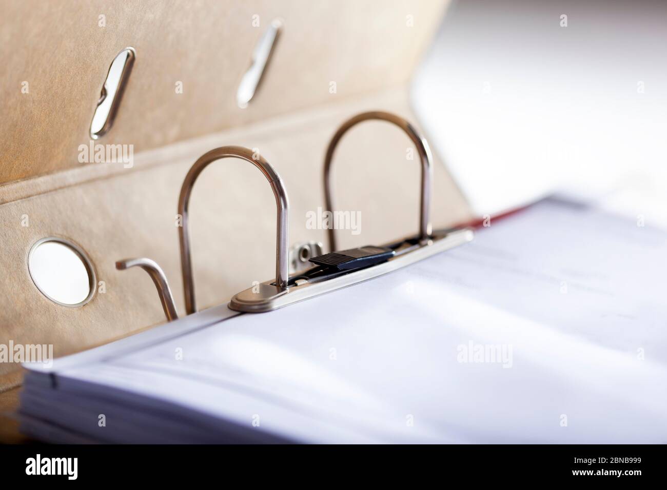 Selective focus on a closed archive ring binder with clip and hardcover Stock Photo