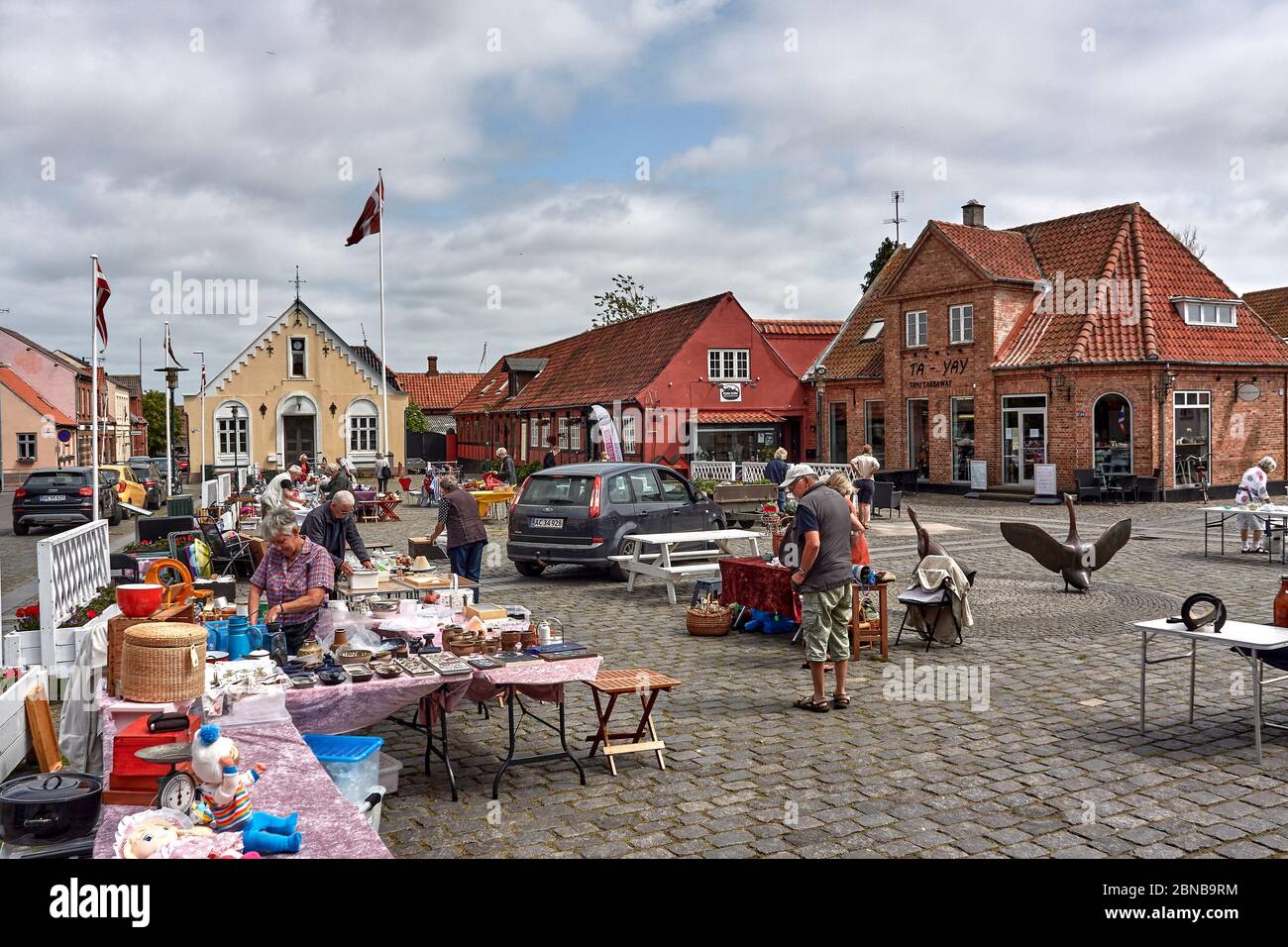 AAKIRKEBY, DENMARK - Jun 27, 2019: Aakirkeby, Bornholm island, Denmark - 27 June 2019. Local people trading goods in city market of Aakirkeby, Bornhol Stock Photo
