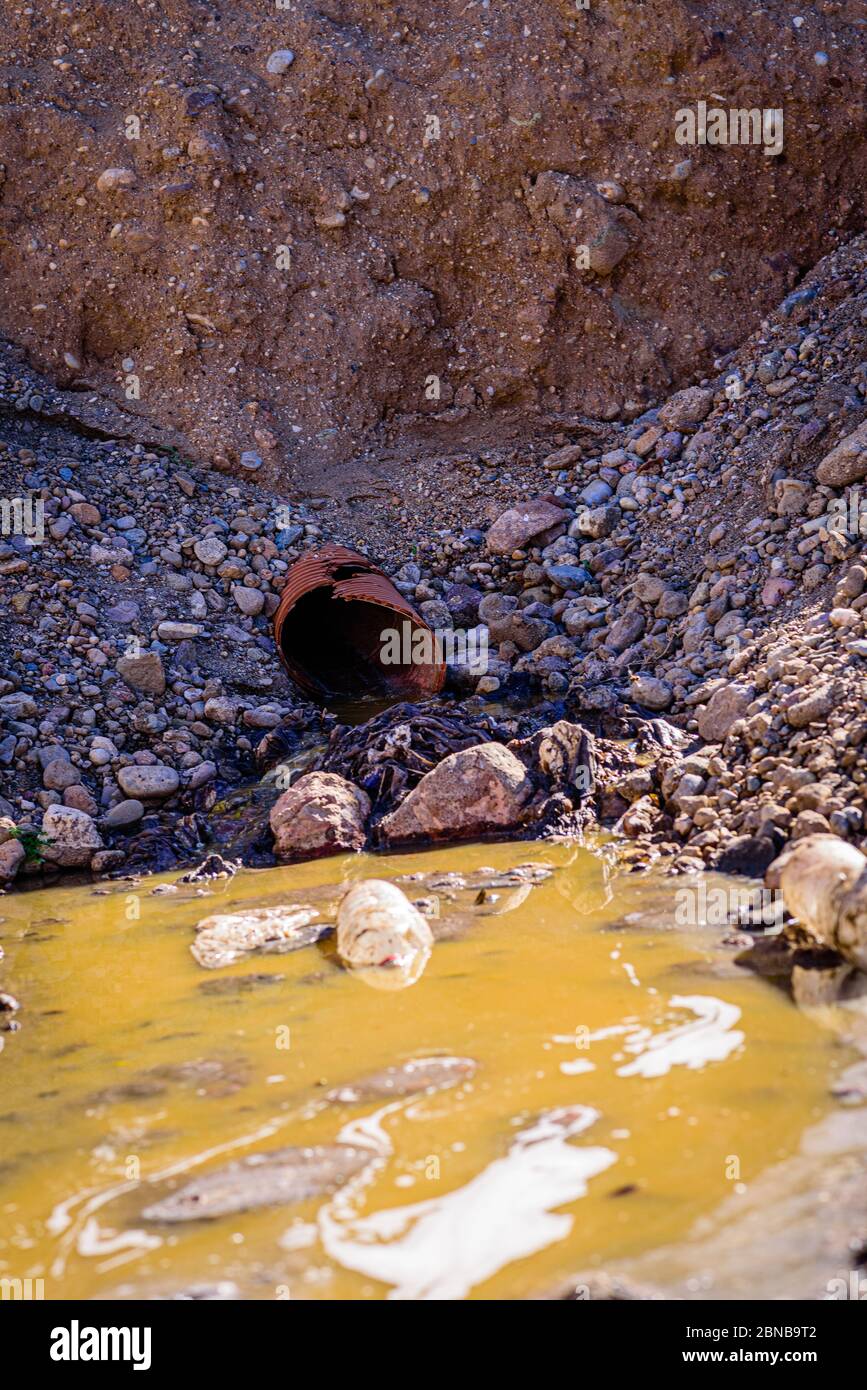 illegal dumping of polluting waters into the environment Stock Photo