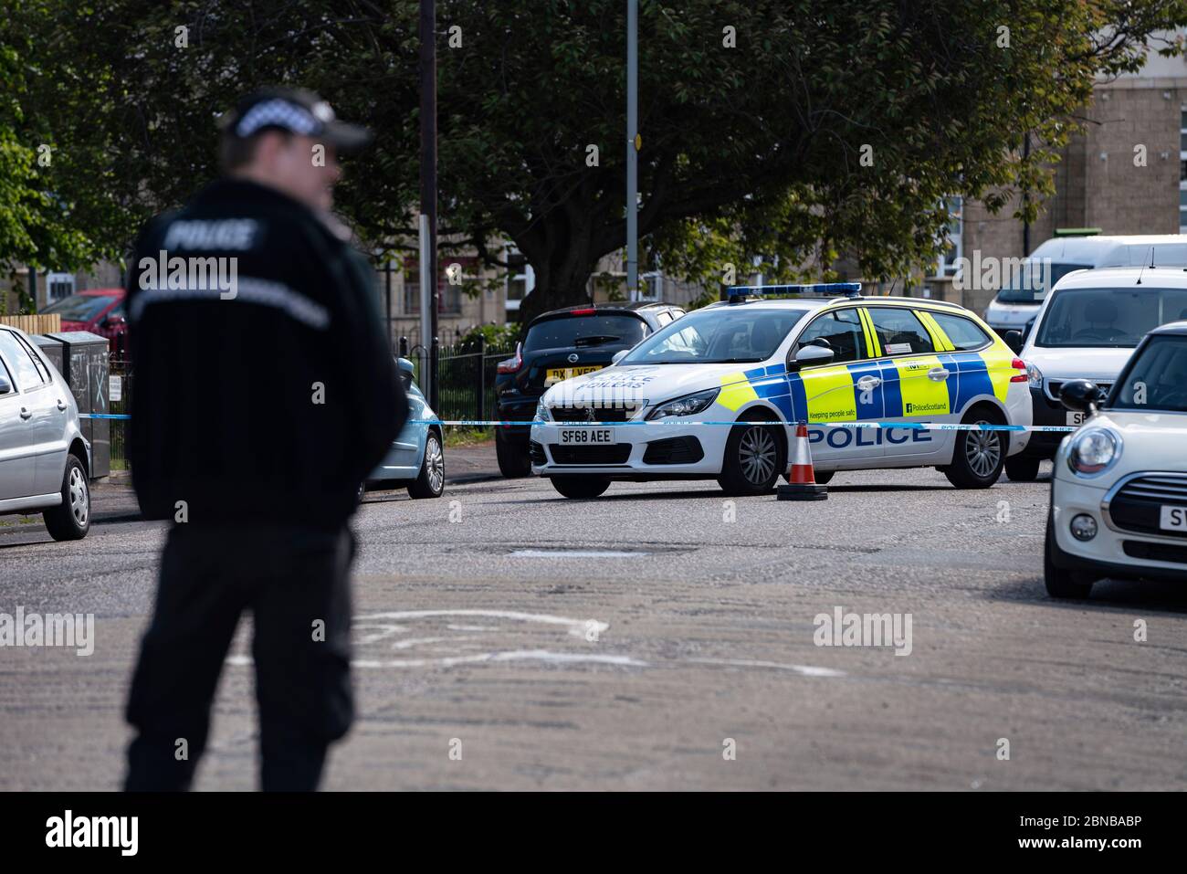 Edinburgh, Scotland, UK. 14 May 2020. Police and forensic team attend a crime scene at address in Restalrig area of Edinburgh following a serious assault at a property in Hawkhill Avenue in the east of the city. The  incident happened around 10.30pm on Wednesday, 13 May, 2020 and a 27-year-old man was taken to Edinburgh Royal Infirmary for treatment for his injuries.  Iain Masterton/Alamy Live News Stock Photo