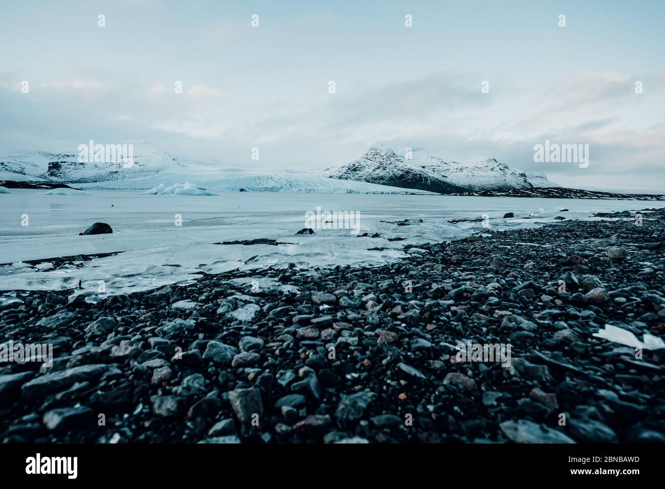 Breathtaking glacier in Iceland with black rock and large ice sheets