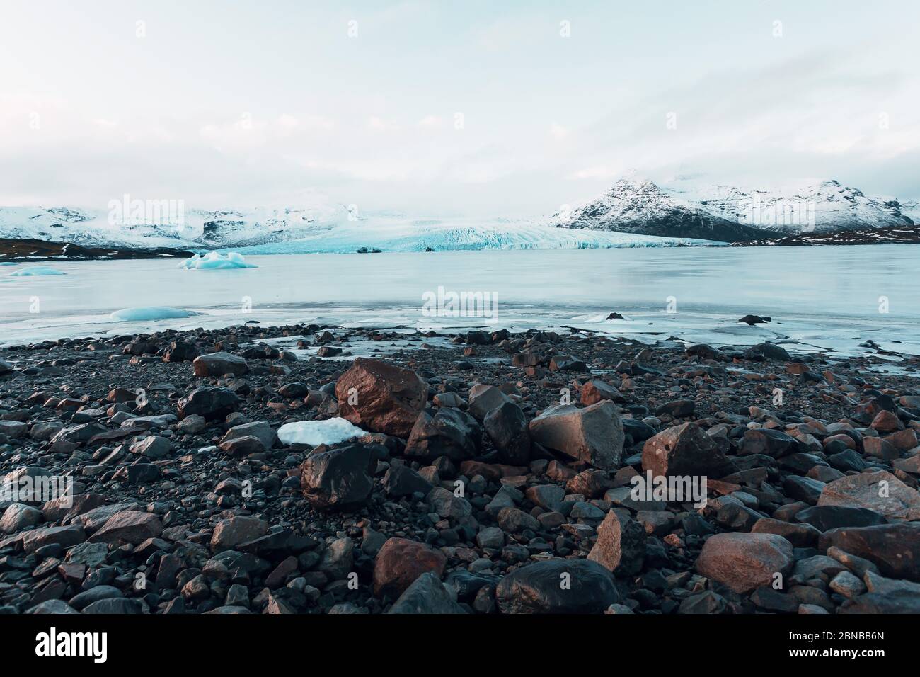 Breathtaking glacier in Iceland with black rock and large ice sheets