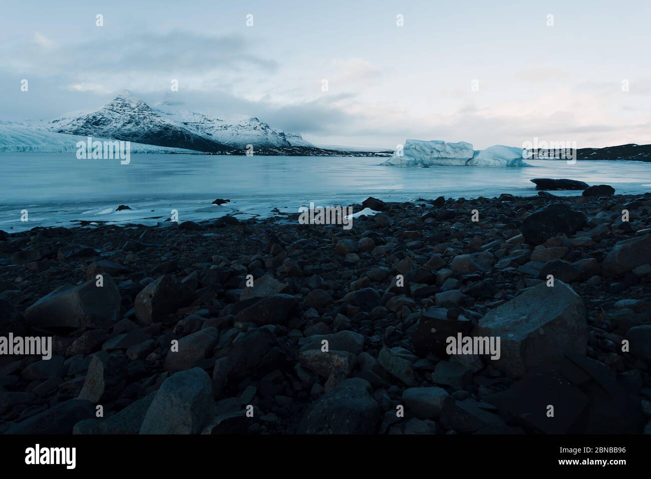 Breathtaking glacier in Iceland with black rock and large ice sheets
