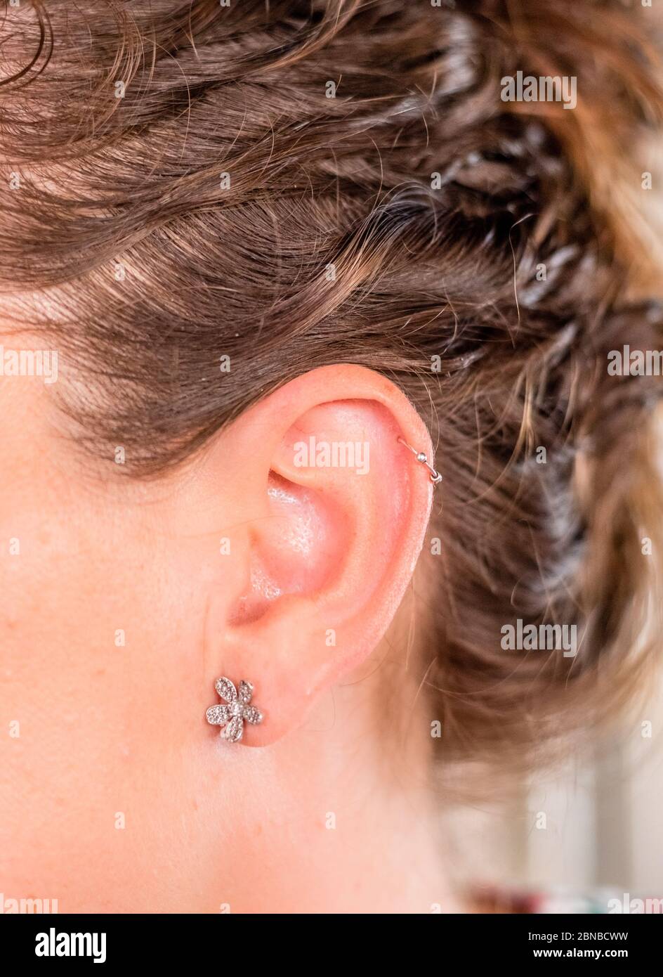 ear with piercing Stock Photo