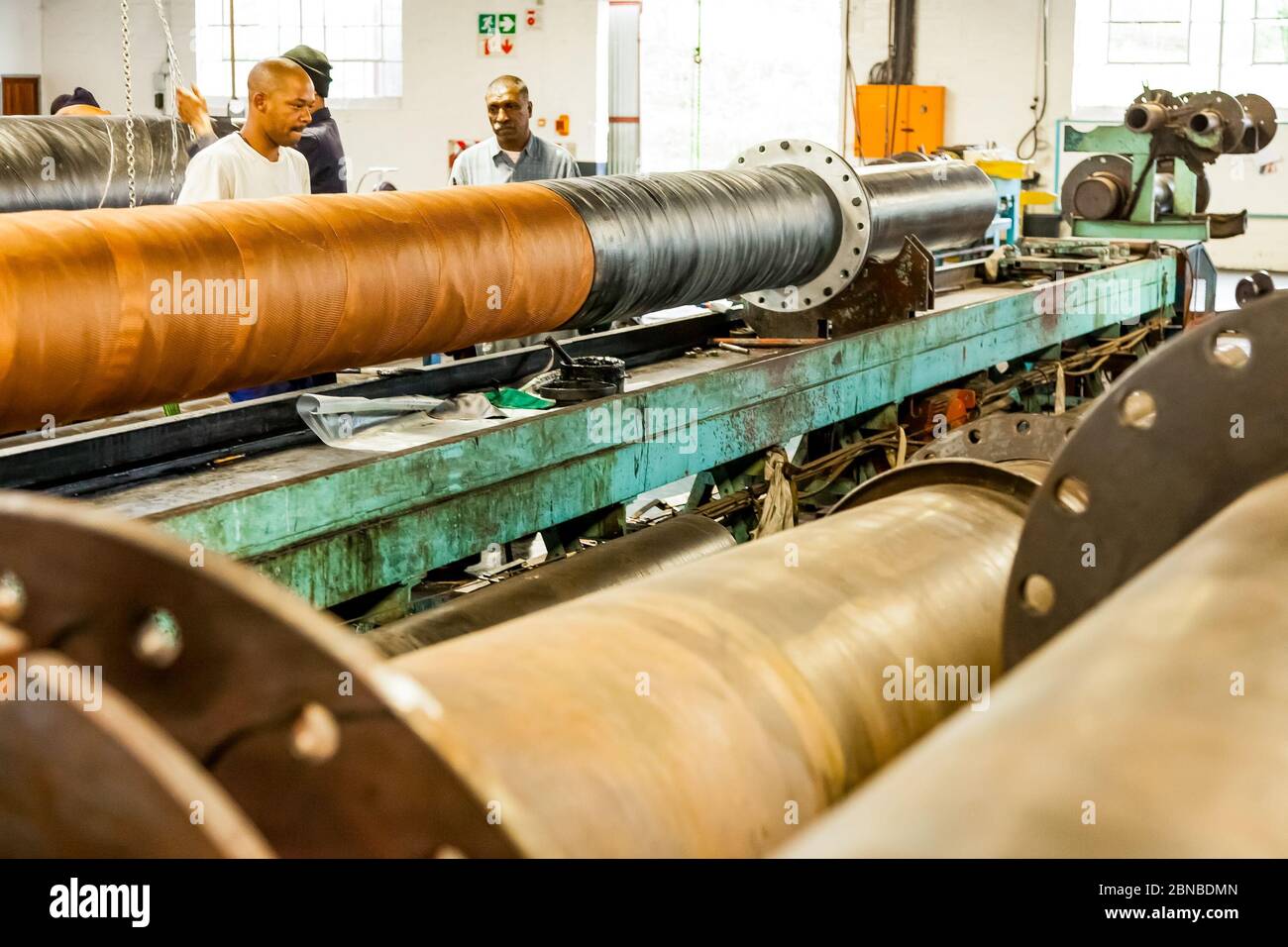 Johannesburg, South Africa - October 19, 2012: Diverse workers inside a ...