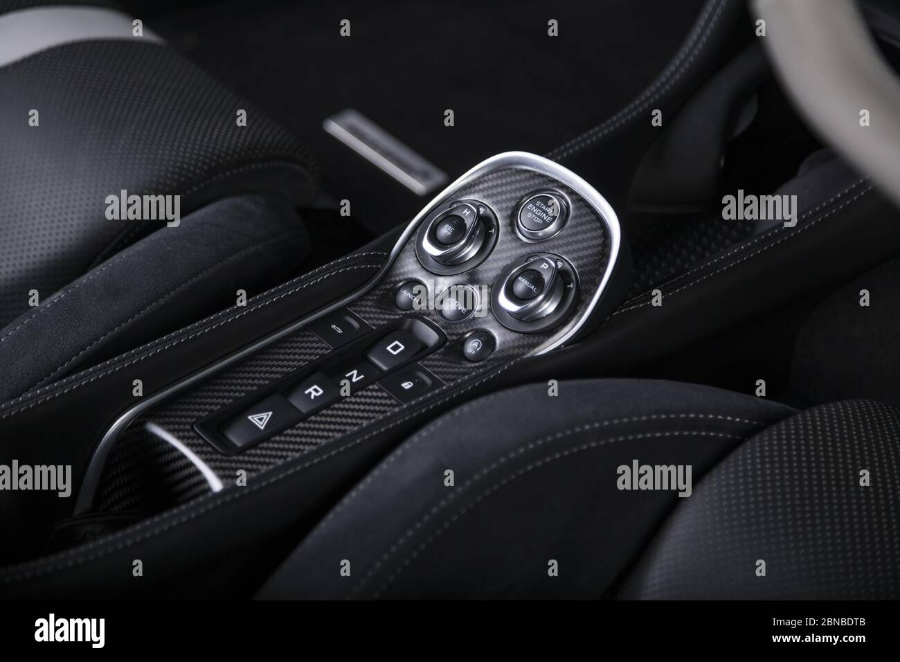 Closeup shot of the engine start buttons inside a modern sport car ...