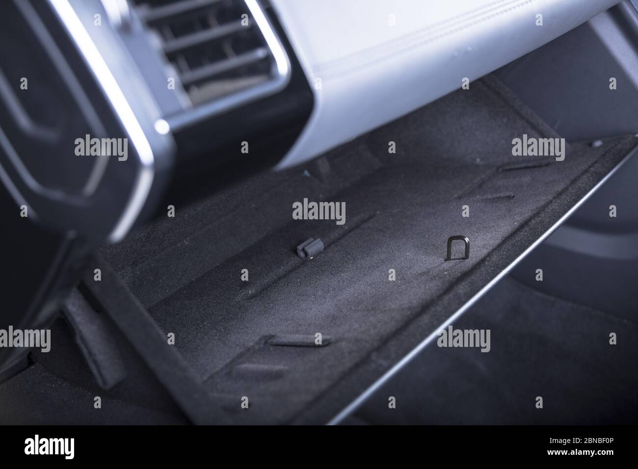 Closeup shot of an open glove compartment in a modern car Stock Photo