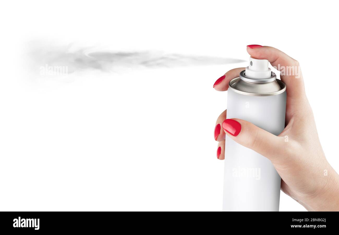 Woman spraying paint from can on white background. Aerosol spray can, metal bottle, paint can. Isolated on white background. With clipping path Stock Photo