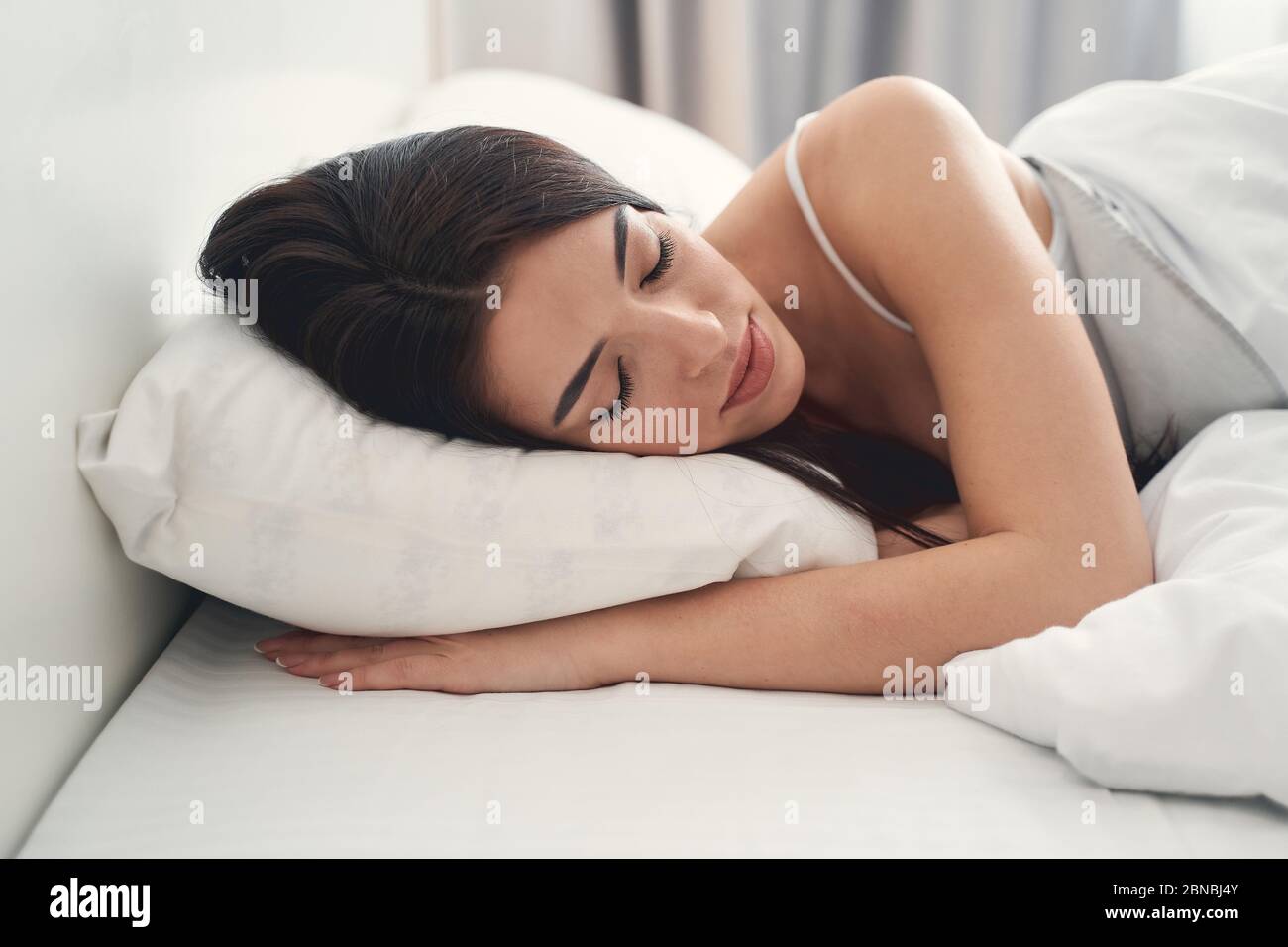 Beautiful calm lady dozing in the morning Stock Photo