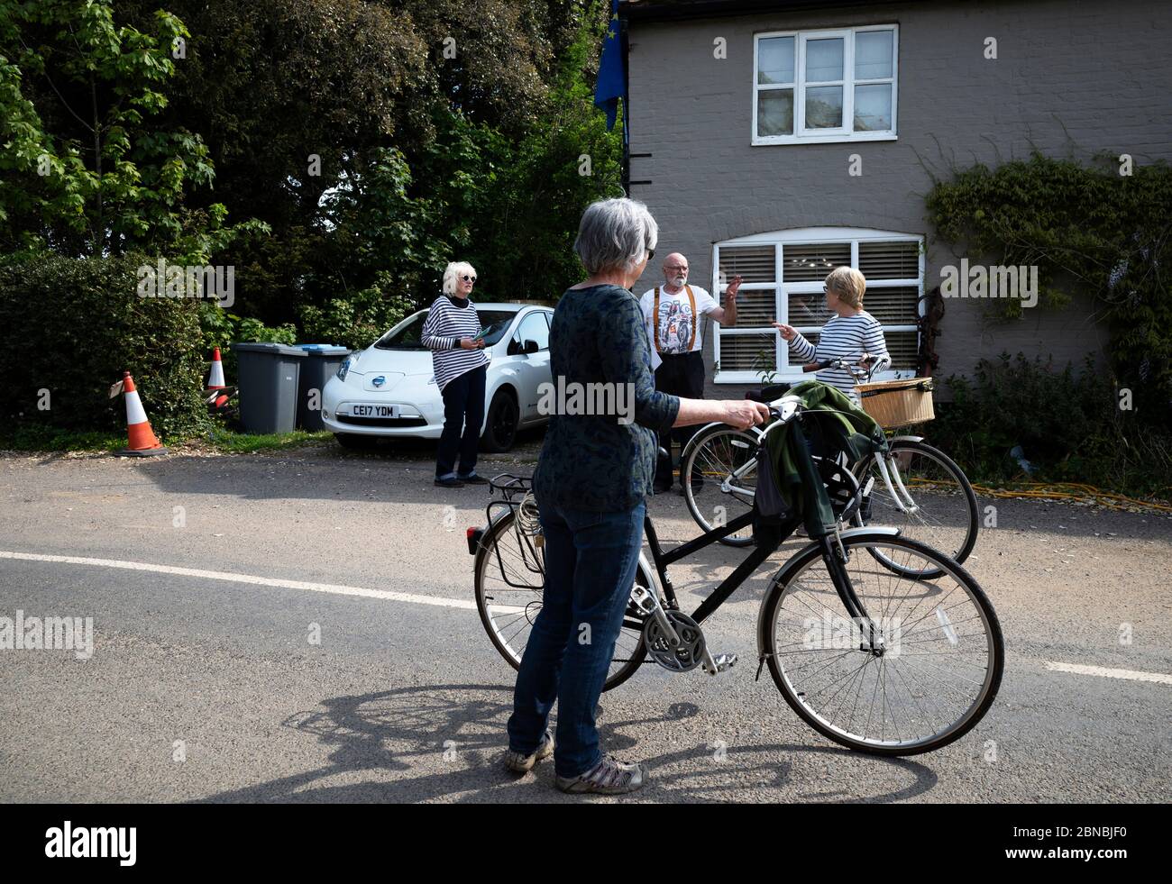 Social distancing cyclists Stock Photo