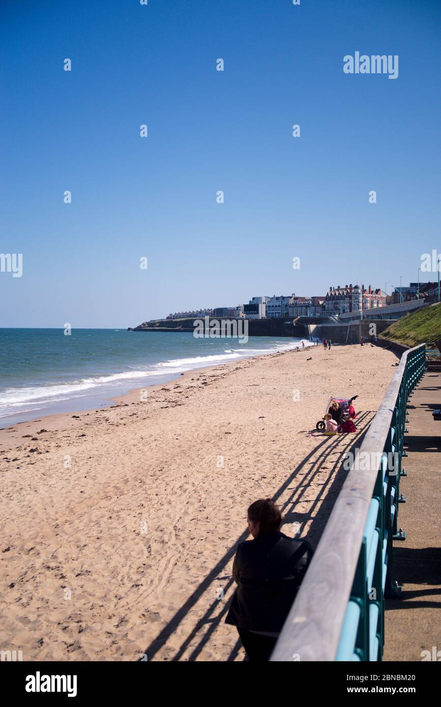 Whitley Bay, England, 6 May 2020. Only a few members of the public are on Whitley Bay beach