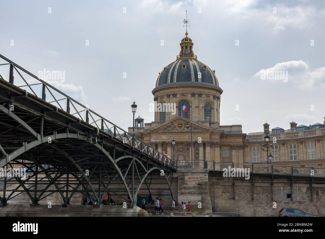 Paris, France. View of the Pont des Arts bridge and the Institut de France, grand cupola-topped building in baroque style. Stock Photo