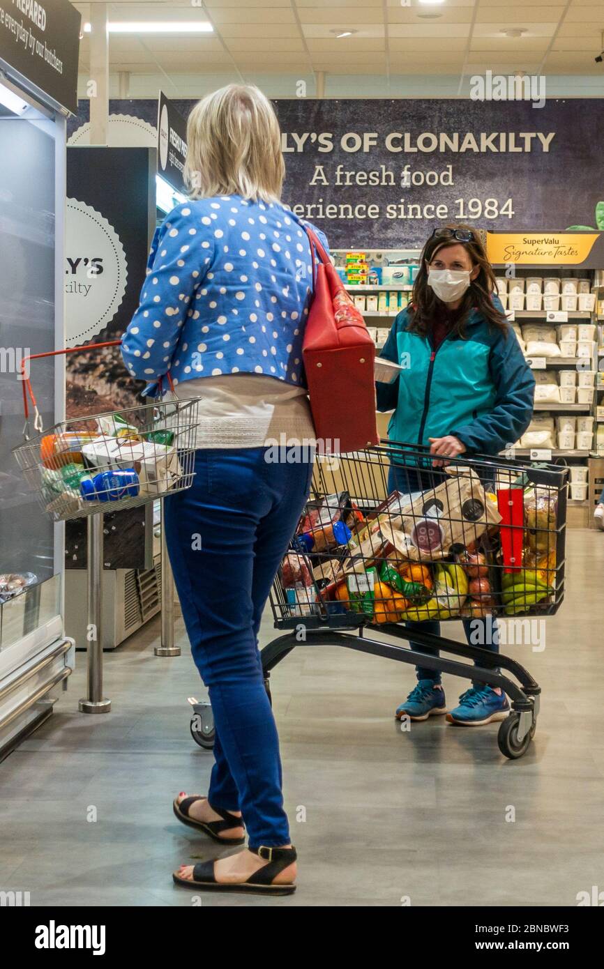 Clonakilty, West Cork, Ireland. 14th May, 2020. A woman wears a face mask to protect herself from Covid-19 as she shops in SuperValu, Clonakilty. Credit: AG News/Alamy Live News Stock Photo