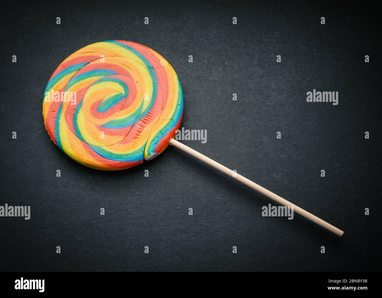 Natural looking lollipop on dark background Stock Photo - Alamy