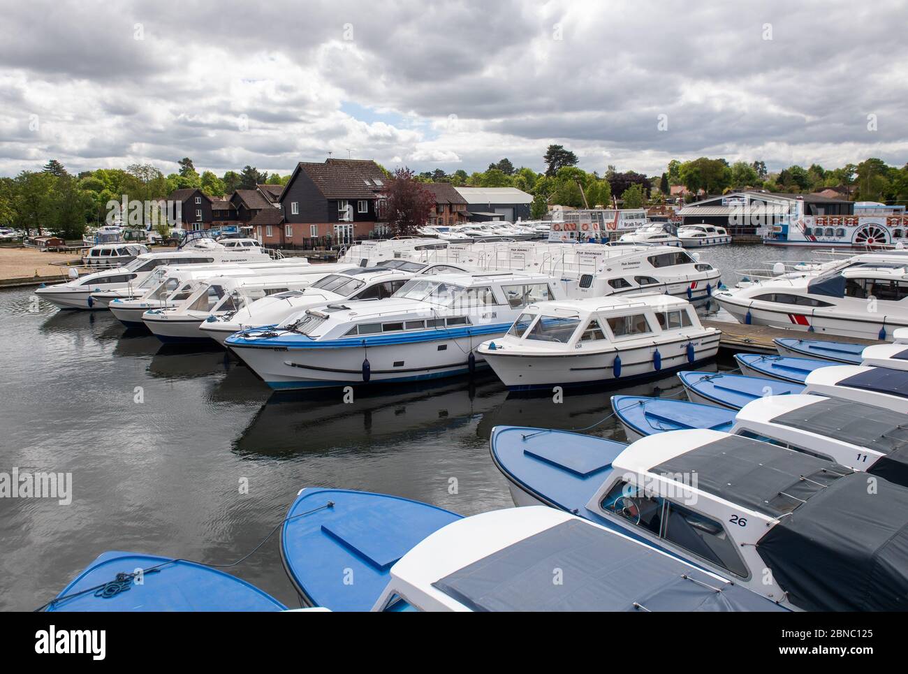 Cabin cruiser boats sit in loynes boatyard in wroxham hires stock