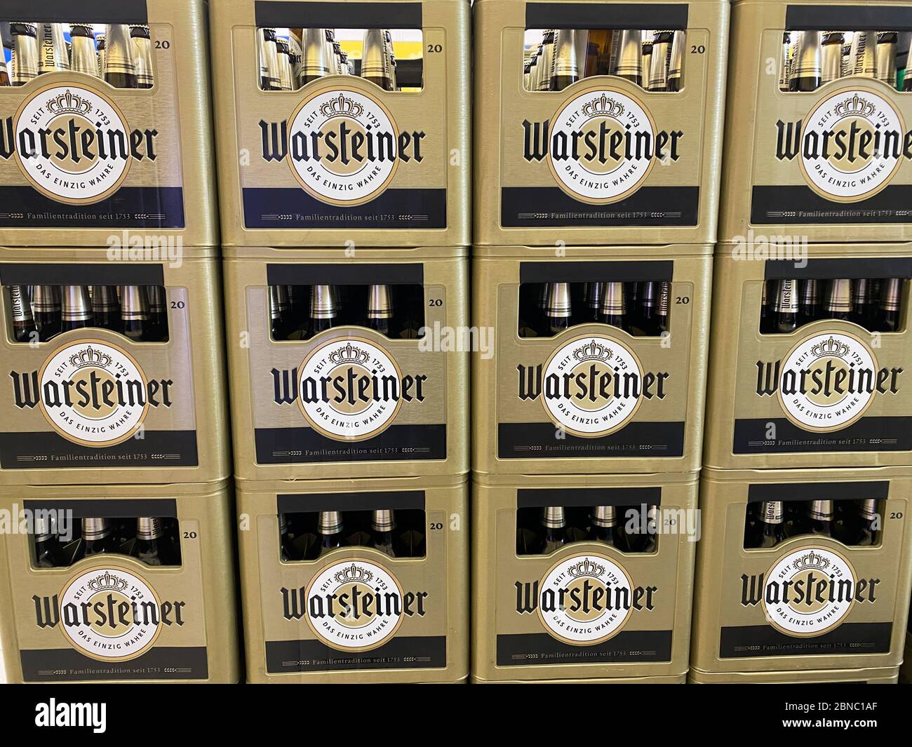 Tönisvorst, Germany - May 14. 2020: View on isolated stacked Warsteiner Pilsener beer cases in german supermarket Stock Photo