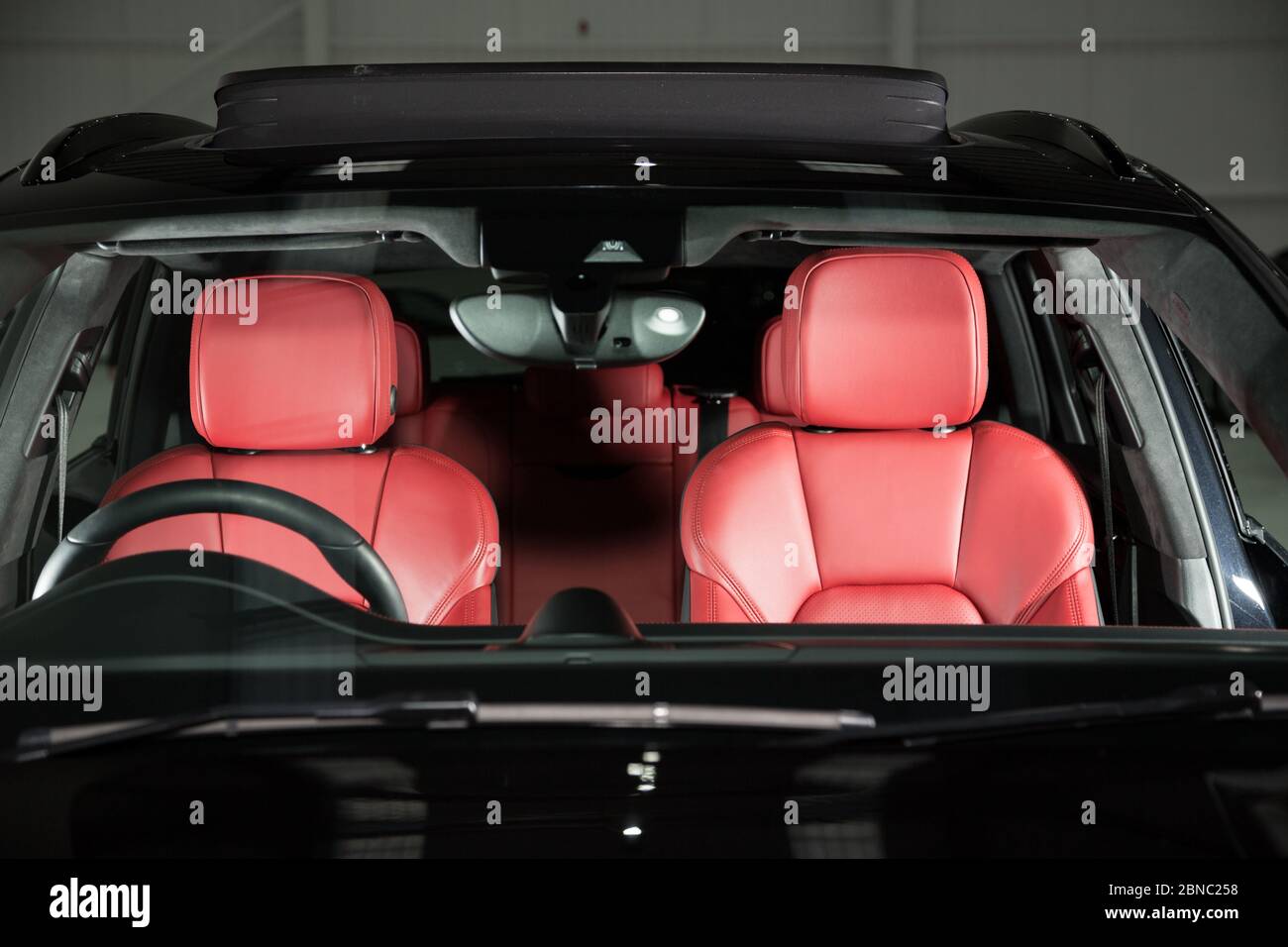 Beautiful red interior of a luxurious car with red and black details ...