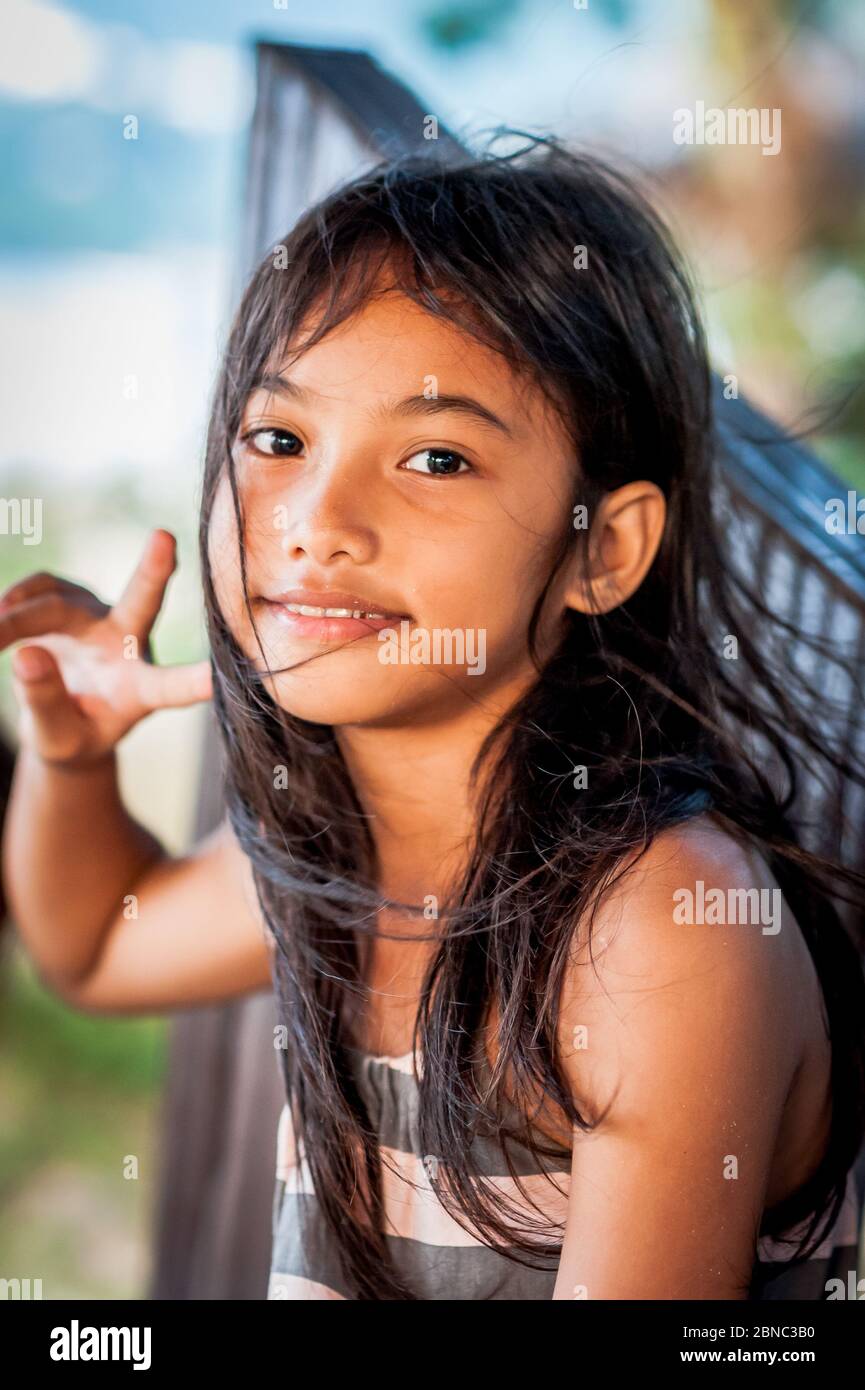 A Pretty Filipino Girl Smiles On Las Cabanas Beach El Nido