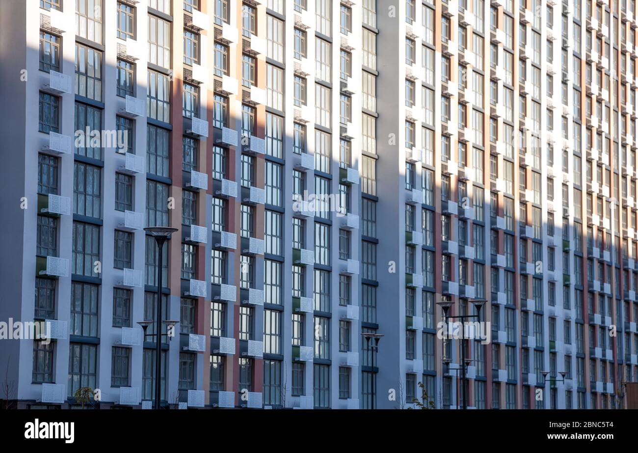 Pattern from the windows of a new multi-storey building. Window in ...