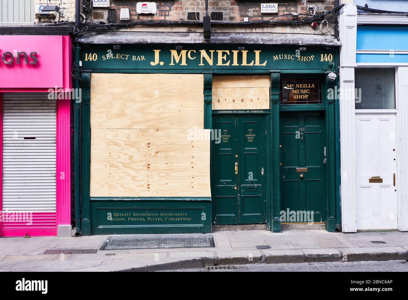 A pub boarded up during the global coronavirus pandemic in Dublin city, Ireland. Stock Photo