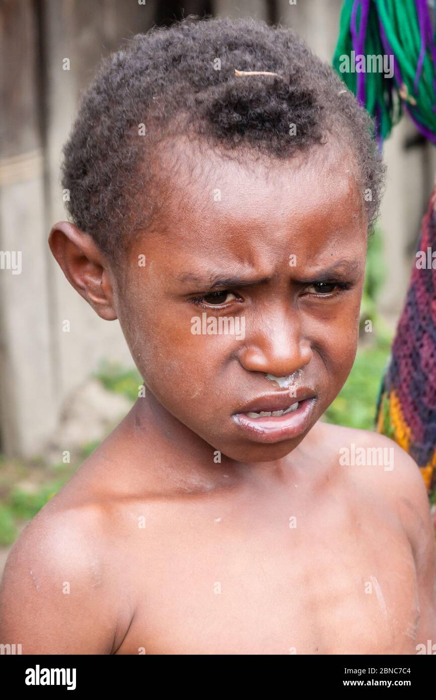 Wamena, Indonesia - January 9, 2010: Portret of Dani tribe boy. Little