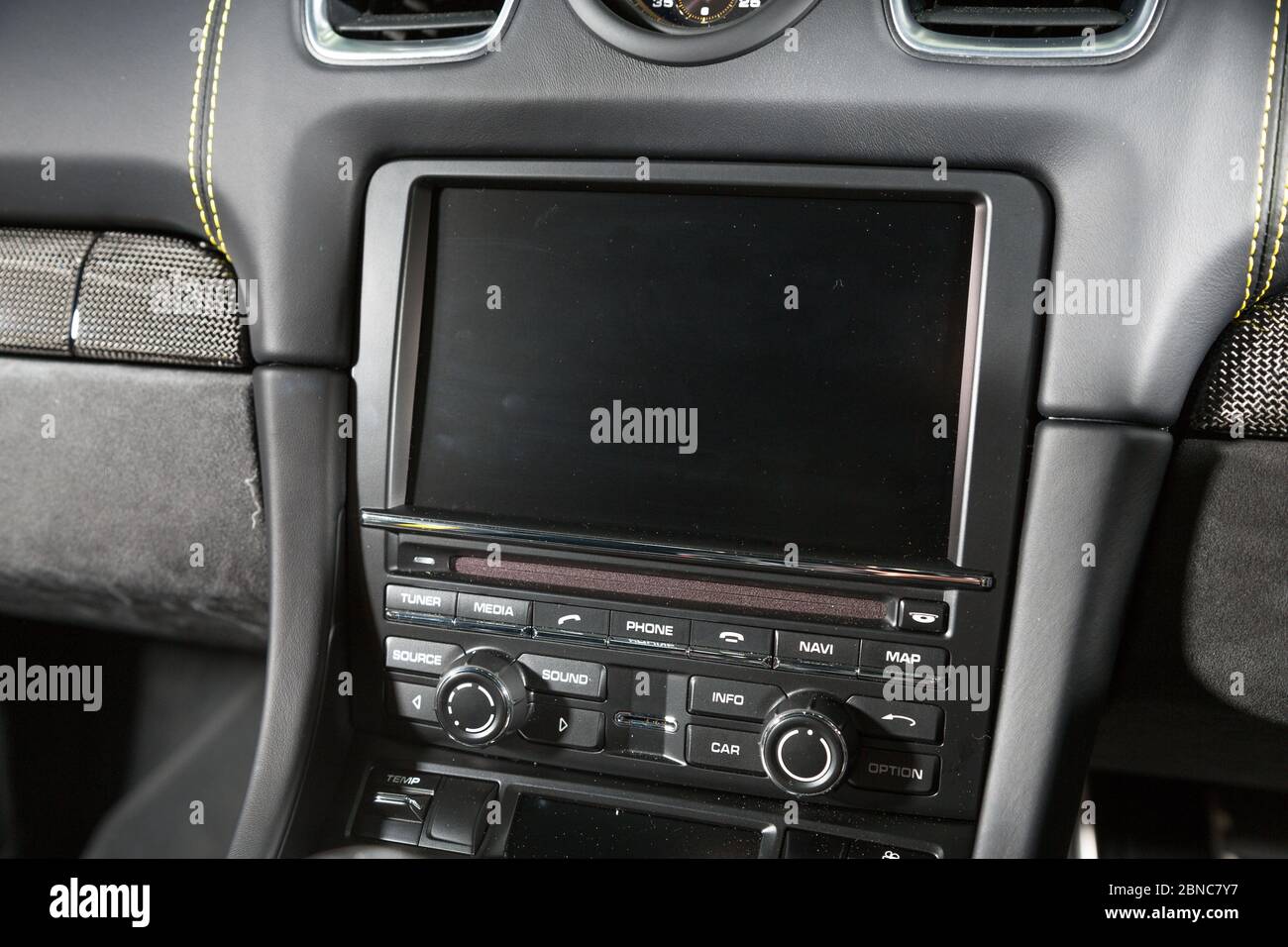 Closeup of the screen and control buttons of a modern car under the ...