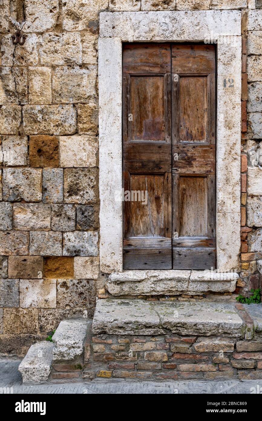 Vertical shot of one of the San Gimignano's historical building's entrance in Tuscany, Florence Stock Photo
