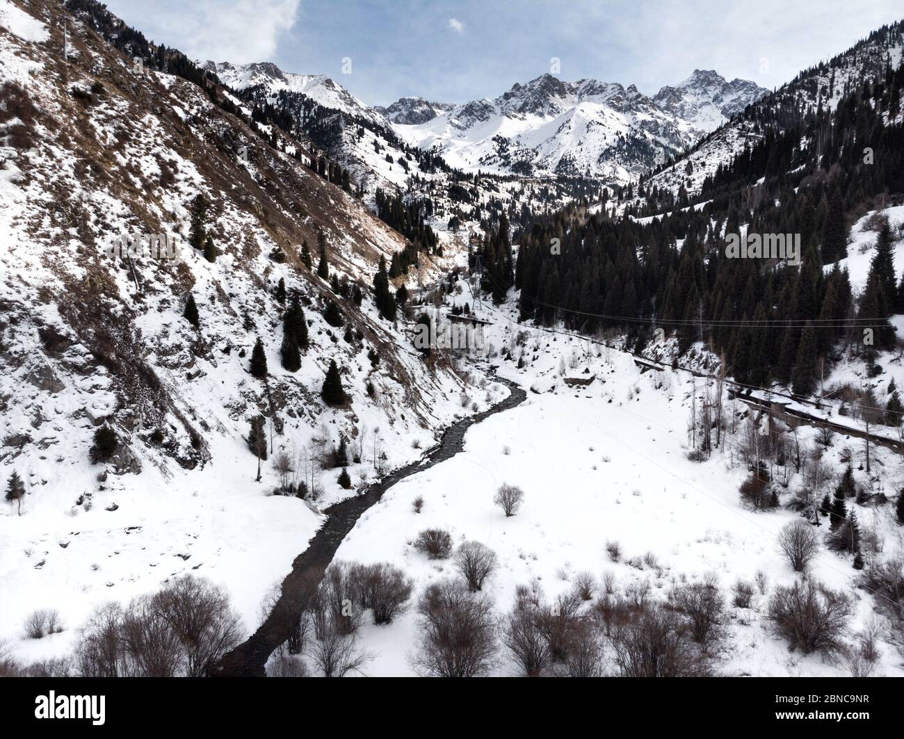 Landscape of river in the valley of Tian Shan mountains at winter time in Almaty, Kazakhstan Stock Photo