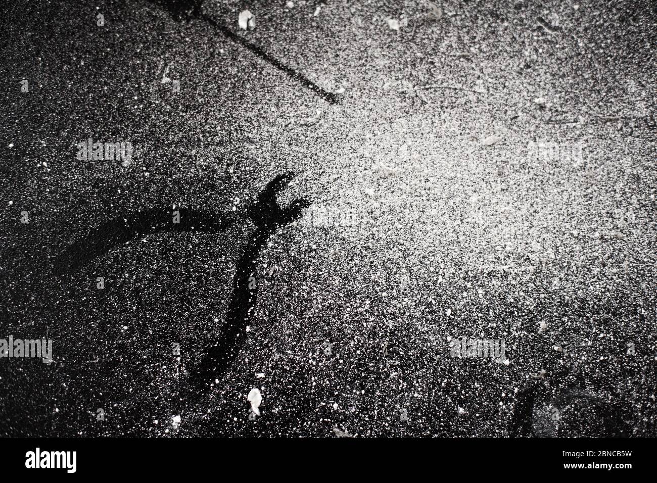 Traces of tools on a black table dusted with white dust Stock Photo - Alamy