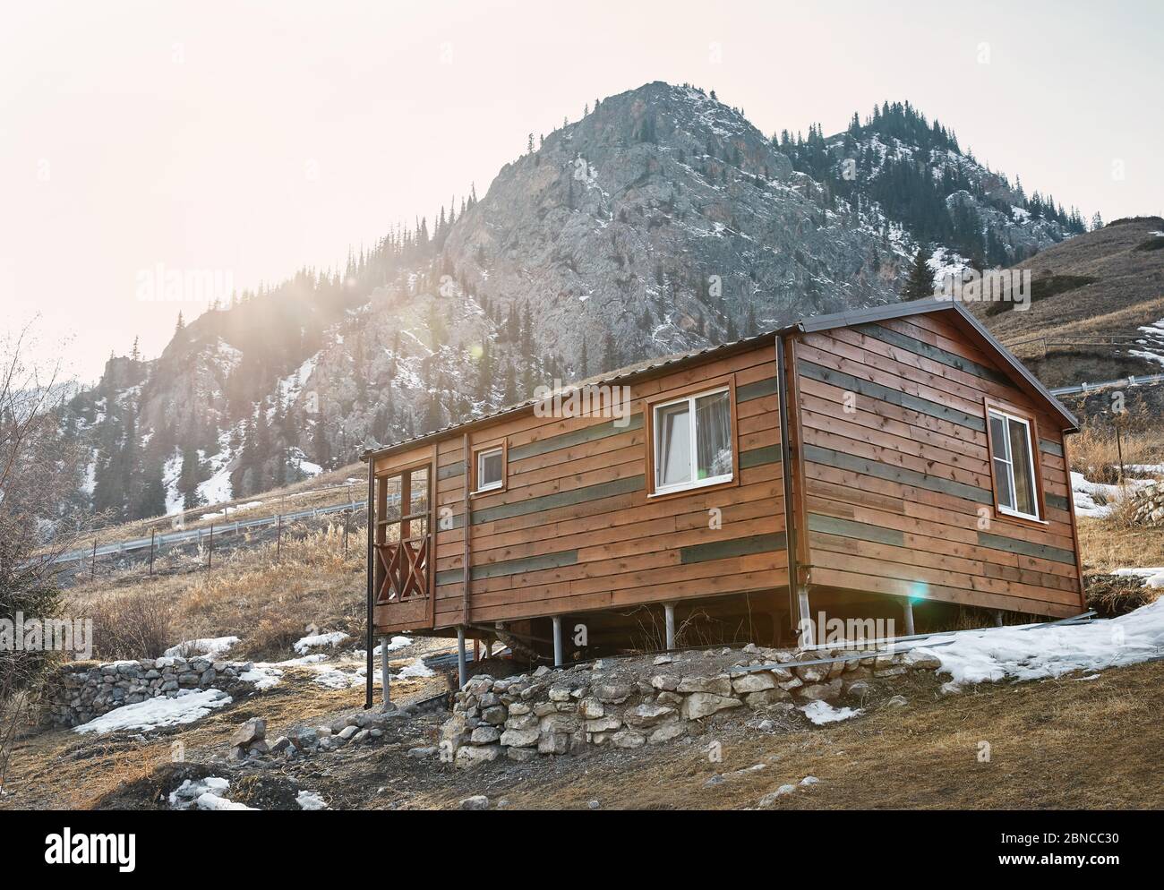 Modern wooden house in the mountain resort at sunset Stock Photo
