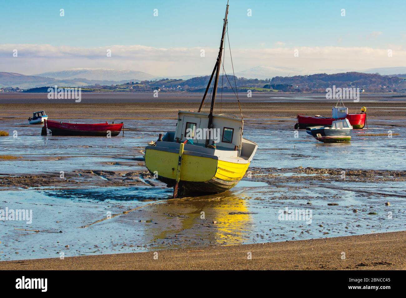 Fishing boats at low tide, Morecambe Stock Photo - Alamy