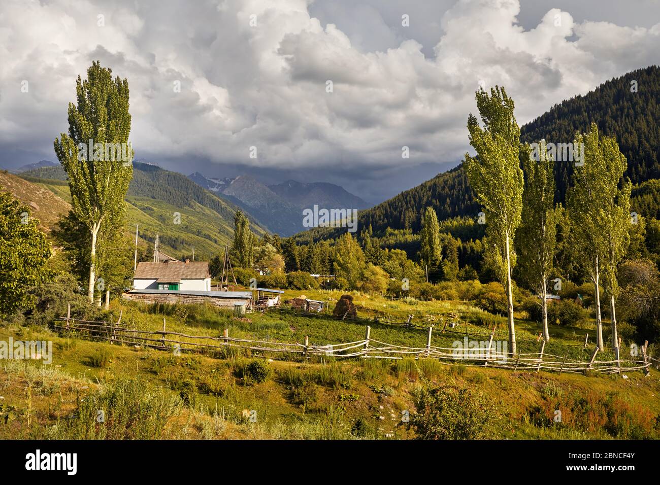 Old house white in the small village in Karakol gorge mountains in Kyrgyzstan Stock Photo