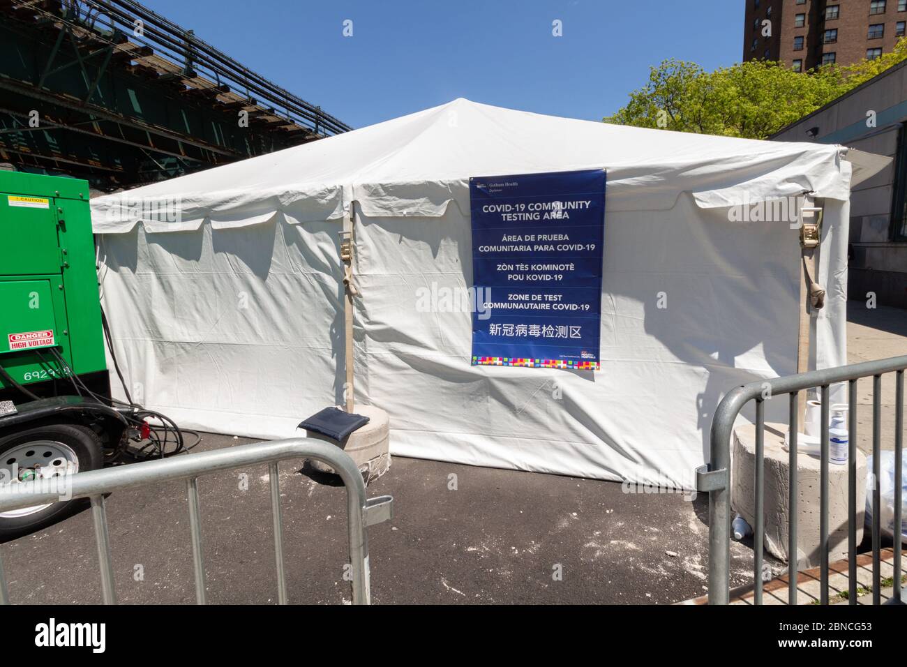 tent next to train tracks in Inwood,  upper manhattan, set up as a free walk-in covid-19 community testing area during the coronavirus pandemic Stock Photo