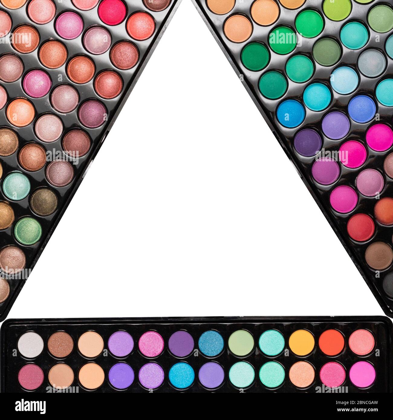 Triangle frame template made of colorful eyeshadow palettes. Flat lay Triangle frame template made of colorful eyeshadow palettes. Flat lay