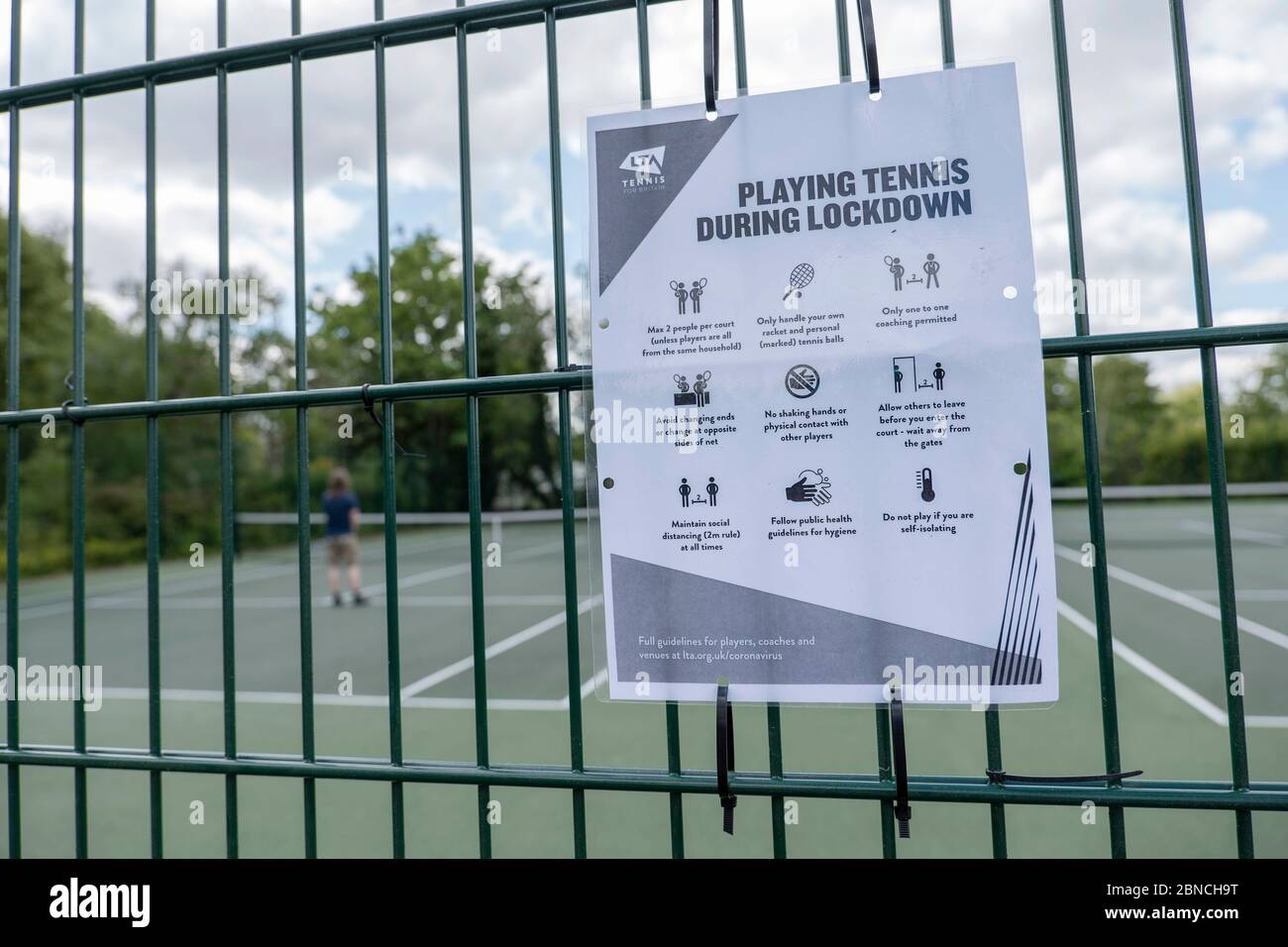 Brockwell Park, UK. 14th May 2020. A 'Playing tennis during lockdown' sign  at the tennis courts in Brockwell Park following Government advice that  lockdown rules have been relaxed for a small number