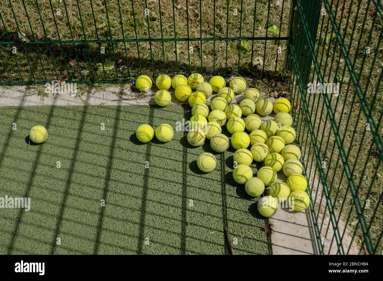Brockwell Park, UK. 14th May 2020. Tennis balls in Brockwell Park following Government advice that lockdown rules have been relaxed for a small number of sports. Tennis, along with golf and basketball, have been cited as a sport that can be played safely, while keeping two metres apart. Brockwell Park is a 50.8 hectare park located south of Brixton, in Herne Hill and Tulse Hill in south London. (photo by Sam Mellish / Alamy Live News) Stock Photo